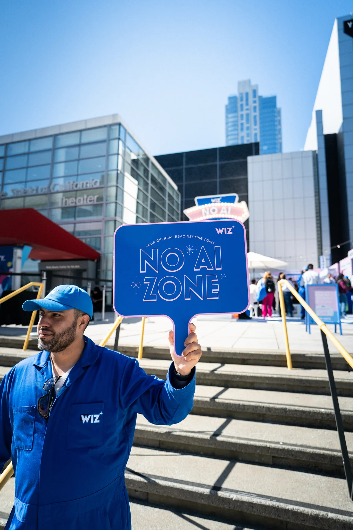Brand ambassador holding a Wiz No AI Zone sign at RSAC 2026 in San Francisco, CA — First Sight Films corporate event photography