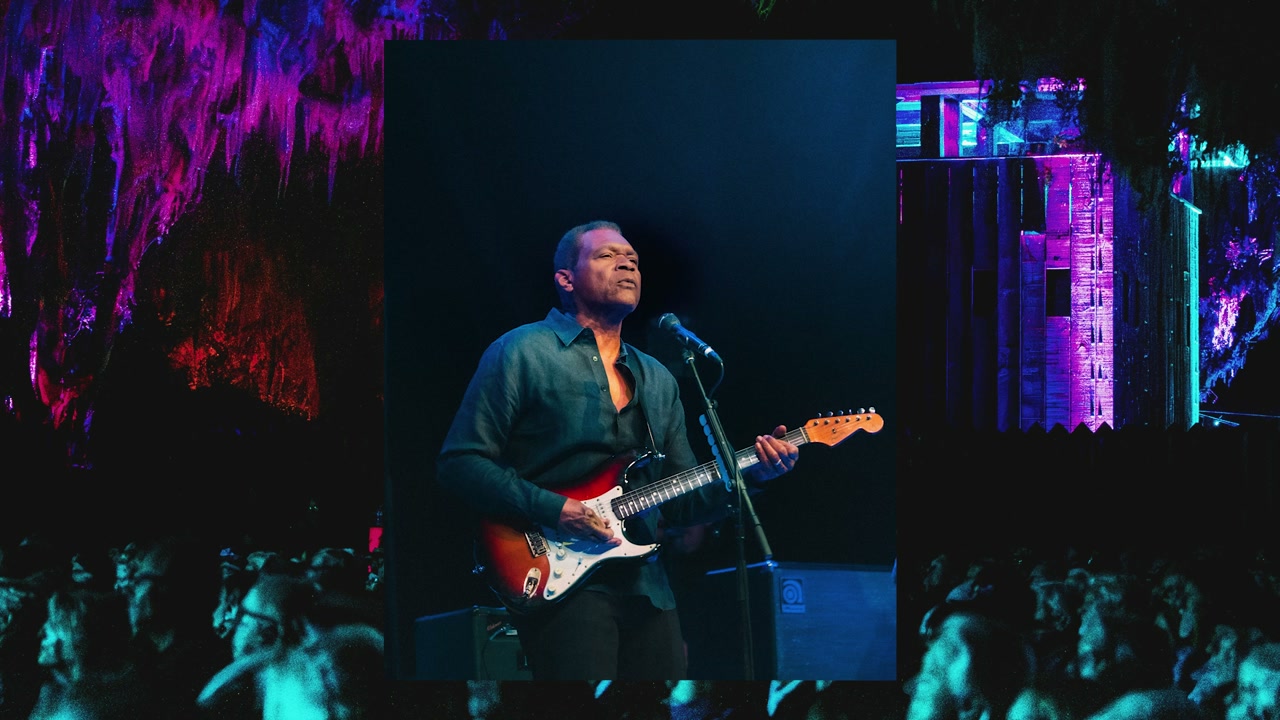 Guitarist performing under colorful stage lighting at the Fort Mose Jazz & Blues Festival in St. Augustine, Florida — First Sight Films