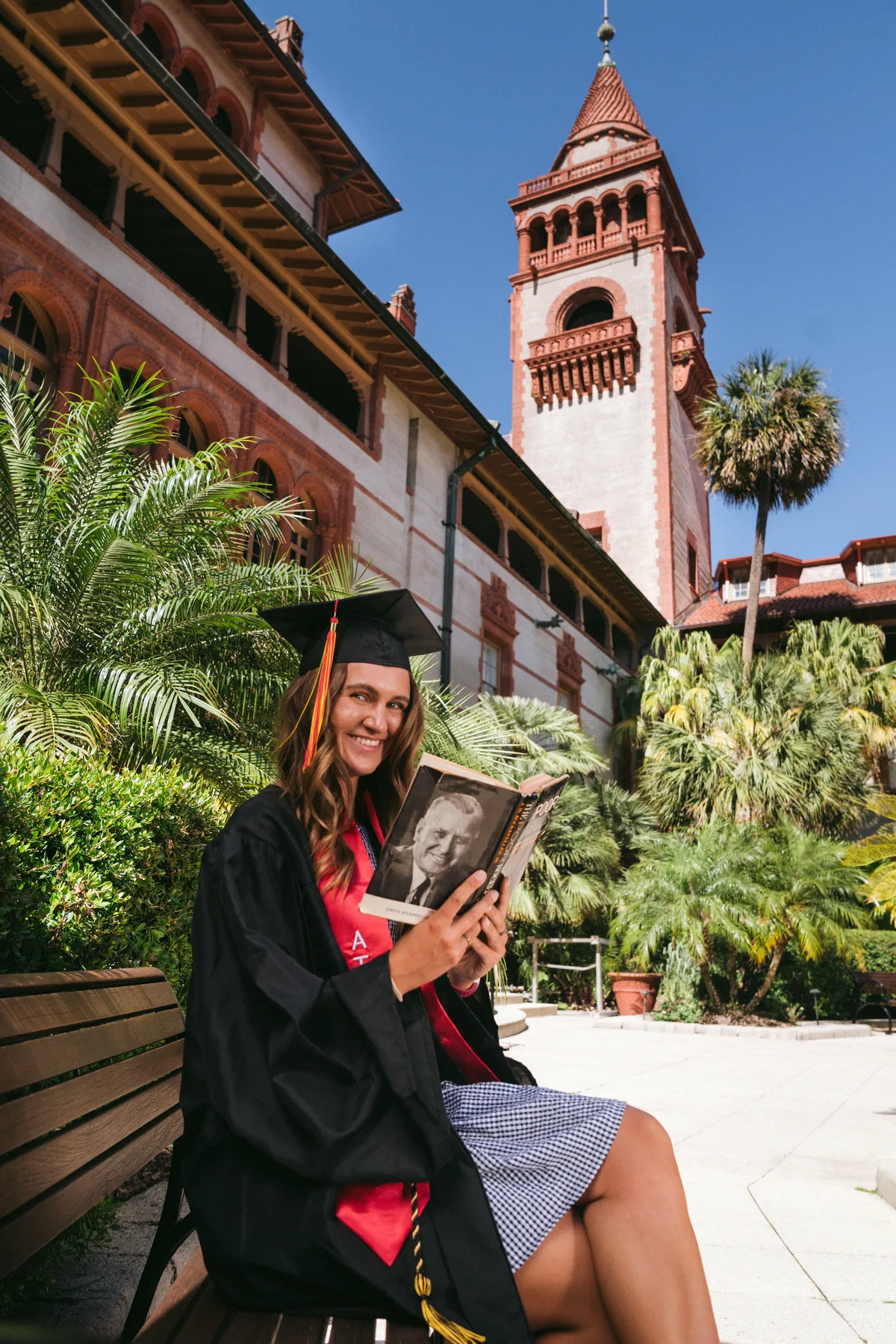 Flagler College graduate seated below the Ponce Hall towers in St. Augustine — First Sight Films