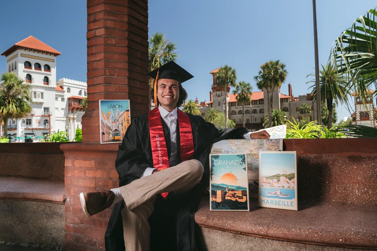 Flagler College graduate with a diploma outside the historic Ponce de Leon Hall — First Sight Films