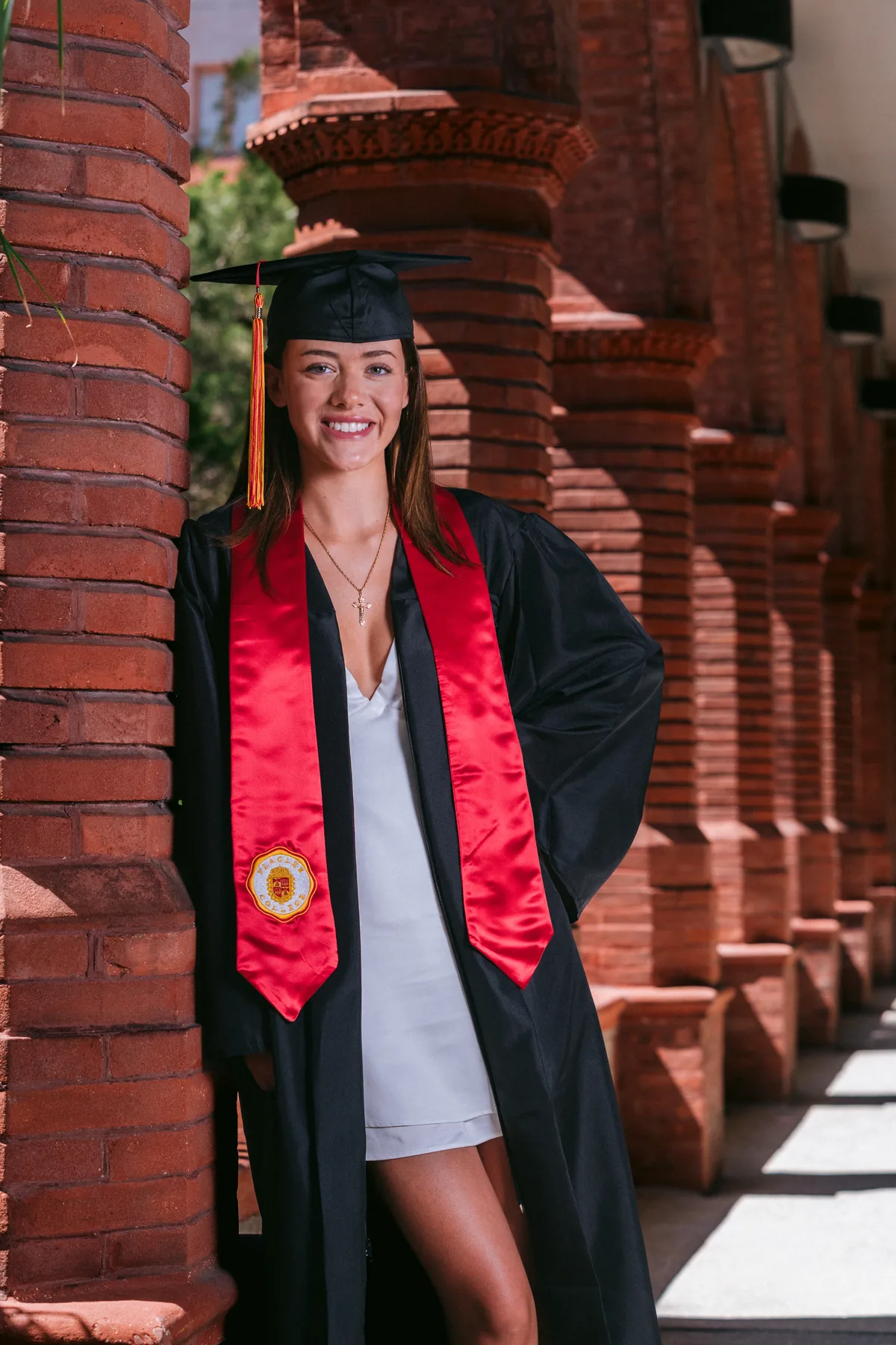 Flagler College graduate seated on the Ponce Hall steps in St. Augustine — First Sight Films