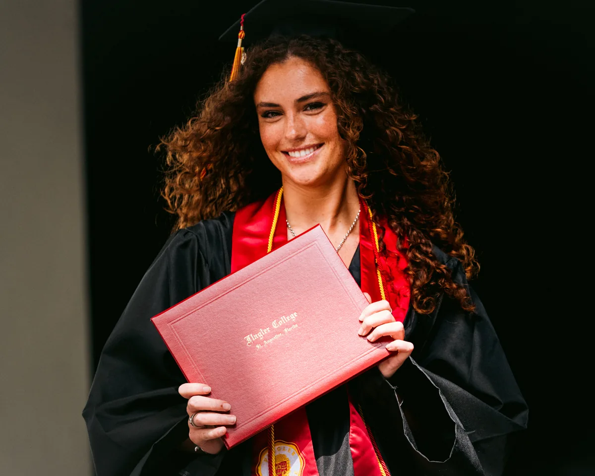 Flagler College graduate with her diploma at commencement in St. Augustine — First Sight Films