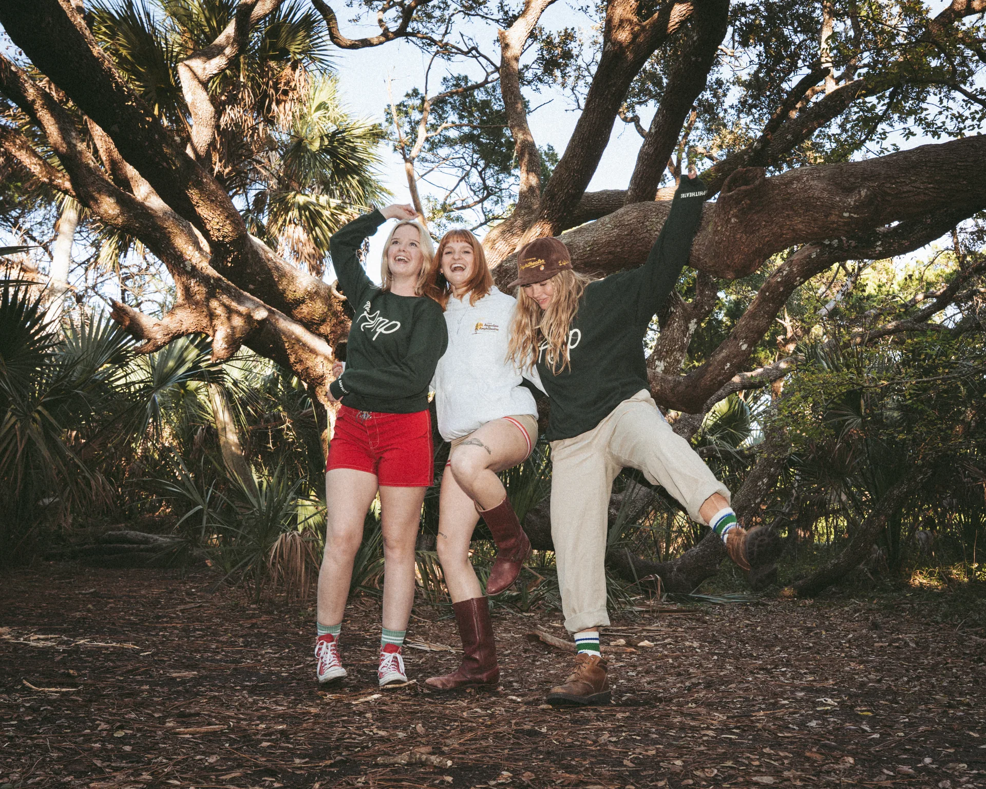 Models wearing Amp merch hanging from oak tree at Anastasia State Park